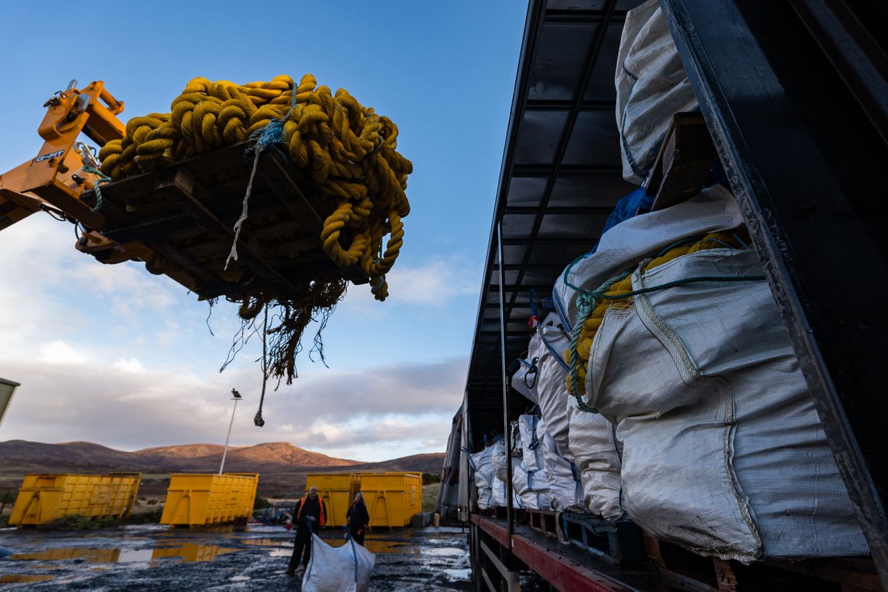 Marine mooring rope and marine plastics from Skye, Scotland being loaded onto a lorry for recycling