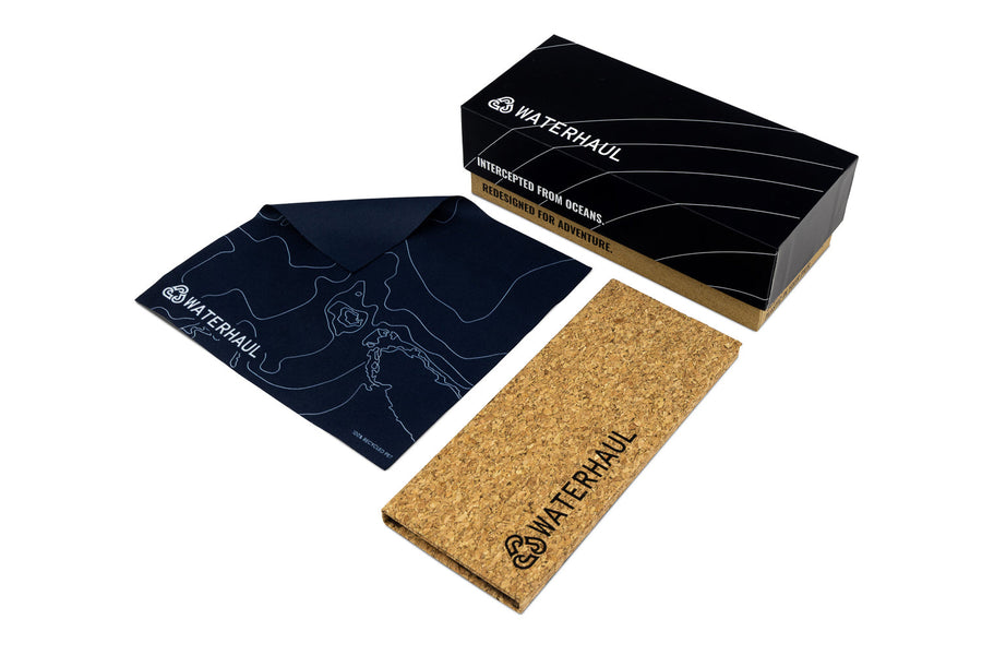 Waterhaul branded Cork sunglasses case and lens cleaning cloth with cardboard packaging on a white background.