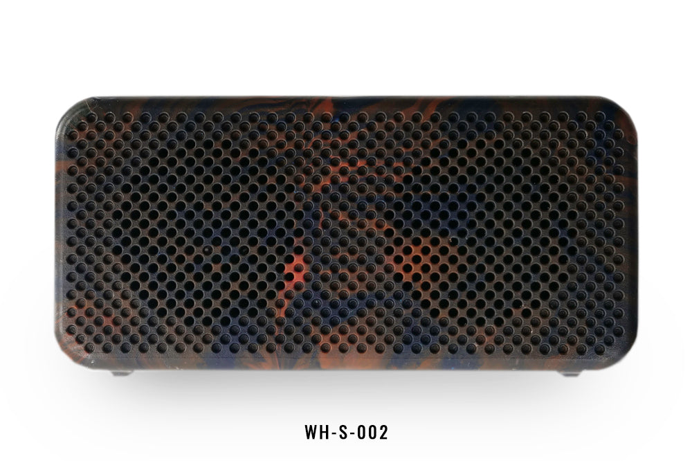 Black and orange rectangular speaker with honeycomb design on a white background.