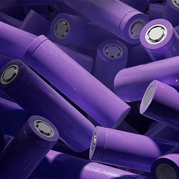 Purple cylindrical batteries with metallic ends on a dark background