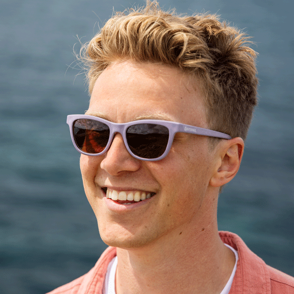 Man wearing sunglasses with a blurred natural background