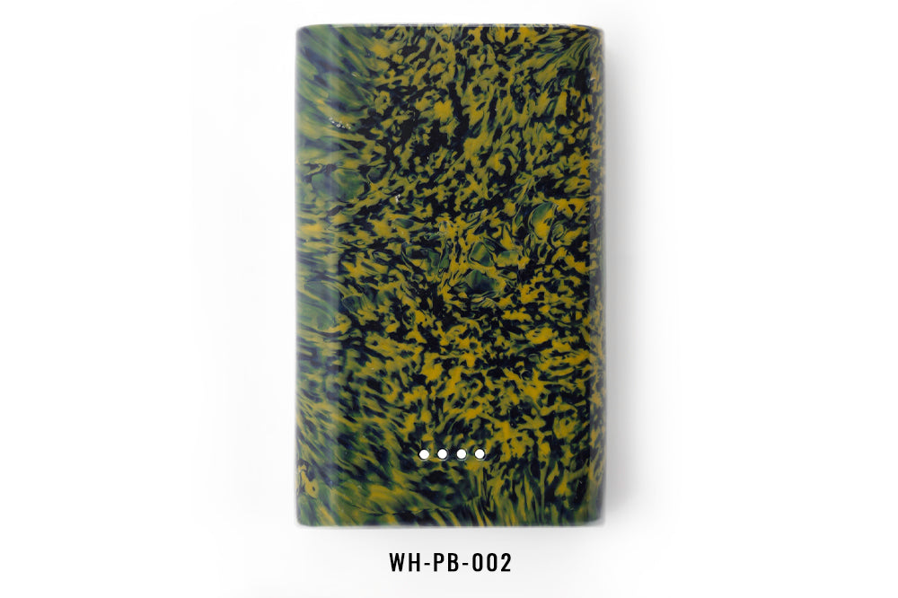 Marbled power bank with black and green pattern on a white background