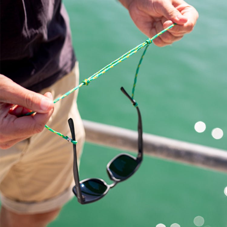 https://waterhauls.com.au/cdn/shop/products/sunglasses-glasses-adjustable-retainer-strap-upcycled-fishing-net-568594.jpg?v=1694128589